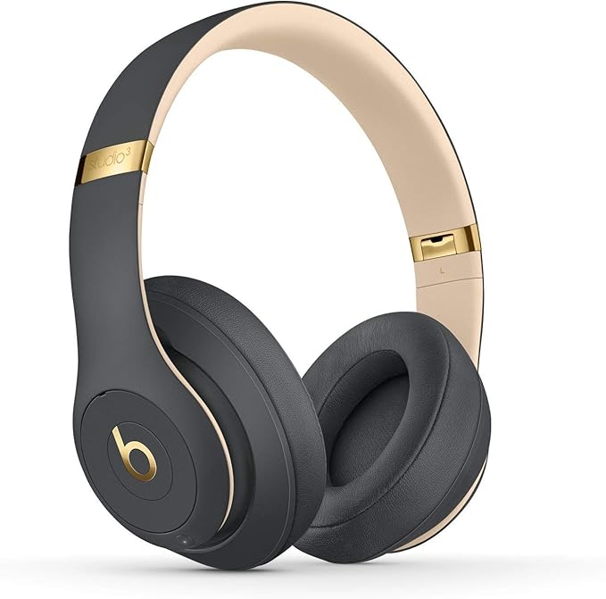 Beats Solo3 Wireless on a desk with laptop and phone